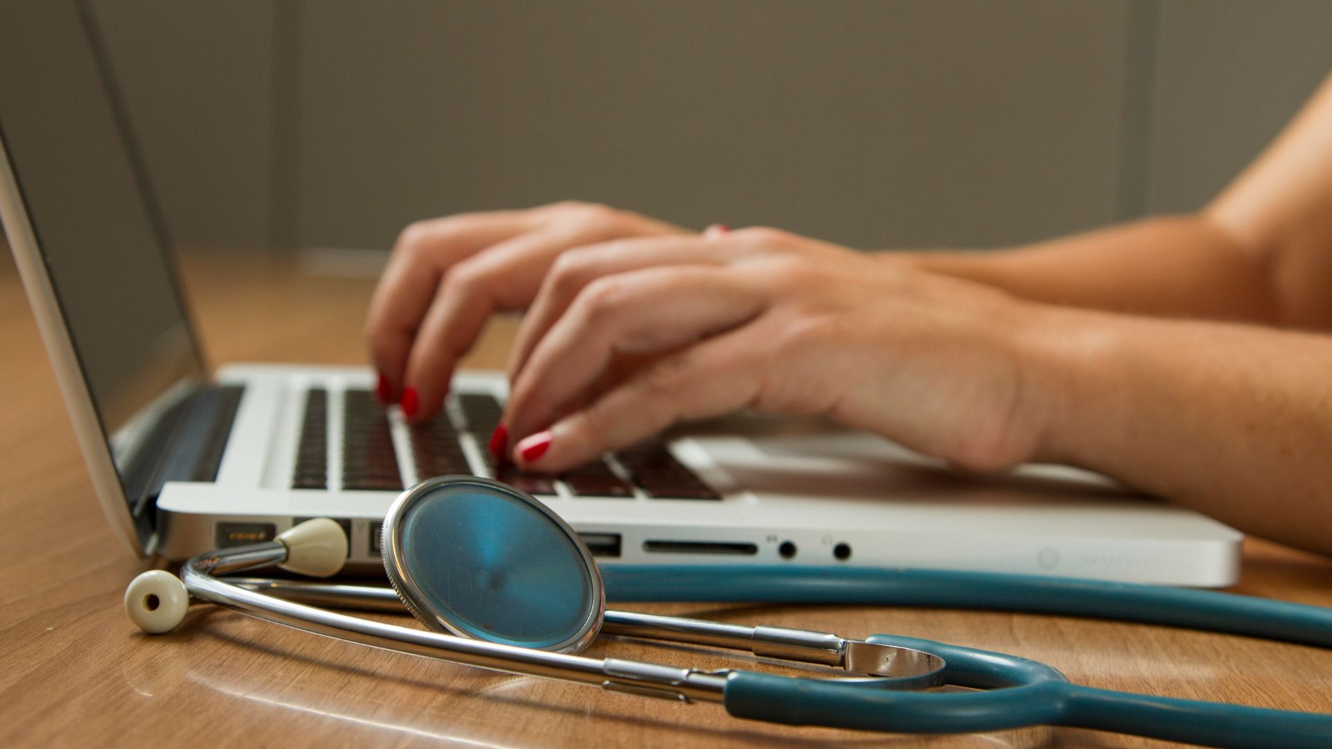 Image of a medical working using a laptop